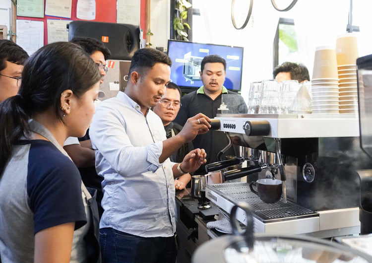 Hands-on barista training with an espresso machine